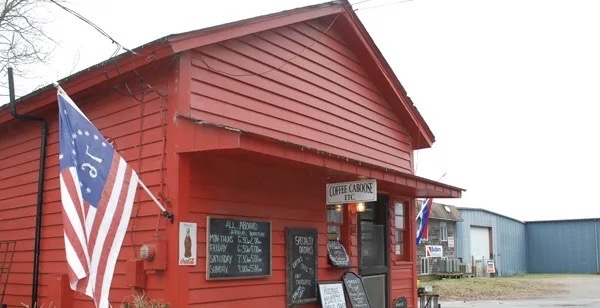 Red coffee shop building with flag