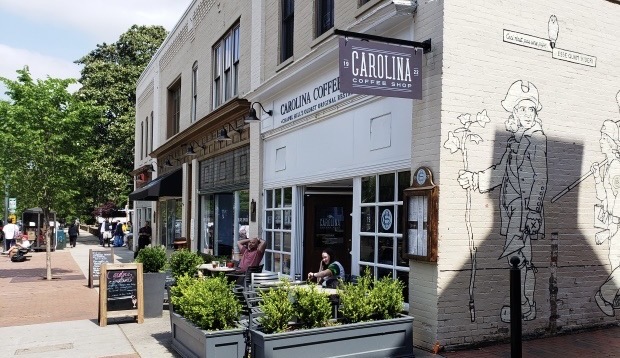 Coffee shop building with sign and drawing on the wall