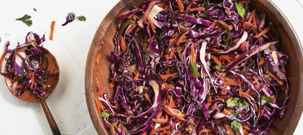 Salad in a wooden plate